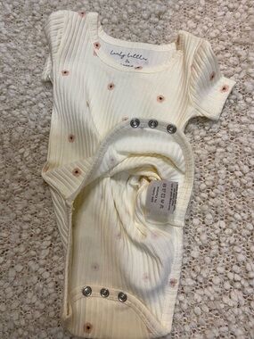 Ribbed Cream Baby Onesie with Pink Dot Accents